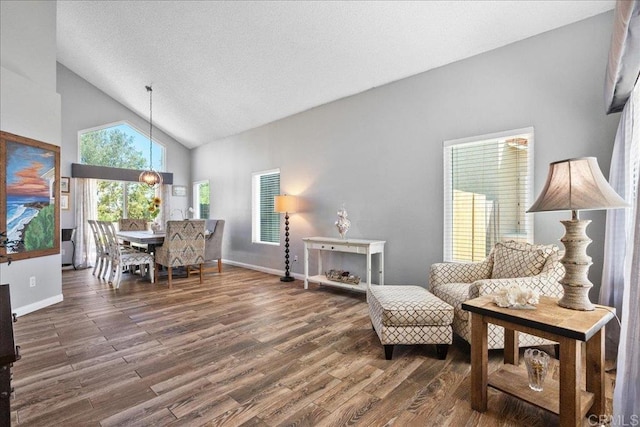 655 Boysenberry Way, Oceanside, CA 92057 - sitting room with wood finished floors, baseboards, high vaulted ceiling, and a chandelier