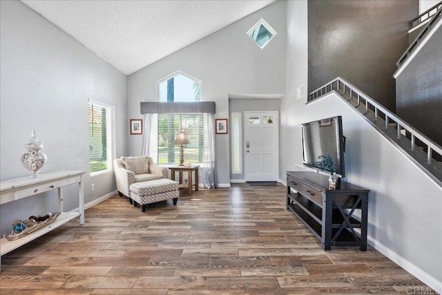 655 Boysenberry Way, Oceanside, CA 92057 - entrance foyer featuring stairway, wood finished floors, high vaulted ceiling, healthy amount of natural light, and baseboards