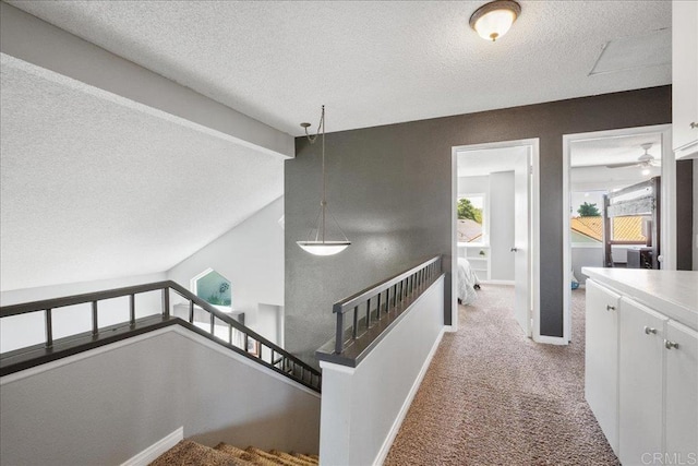 655 Boysenberry Way, Oceanside, CA 92057 - corridor with a textured ceiling, carpet flooring, and baseboards