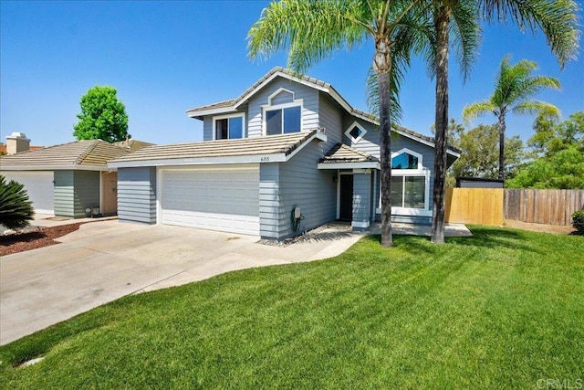 655 Boysenberry Way, Oceanside, CA 92057 - traditional-style home featuring an attached garage, driveway, and a tiled roof