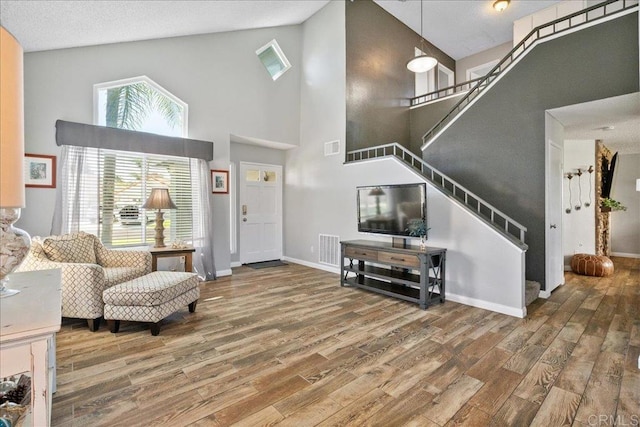 655 Boysenberry Way, Oceanside, CA 92057 - entryway featuring high vaulted ceiling, stairway, and wood finished floors