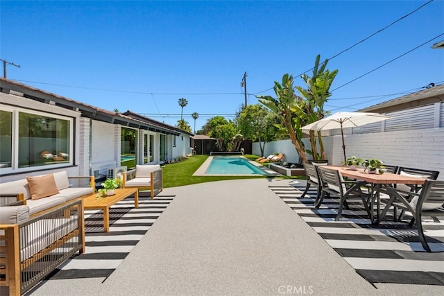3830 Cedar Ave, Long Beach, CA 90807 - fenced backyard with an outdoor living space, a patio, and outdoor dining space
