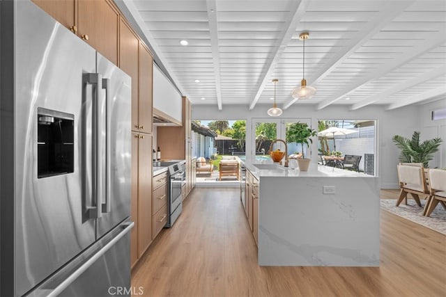 3830 Cedar Ave, Long Beach, CA 90807 - kitchen with appliances with stainless steel finishes, light wood-style floors, a sink, a kitchen island with sink, and beam ceiling