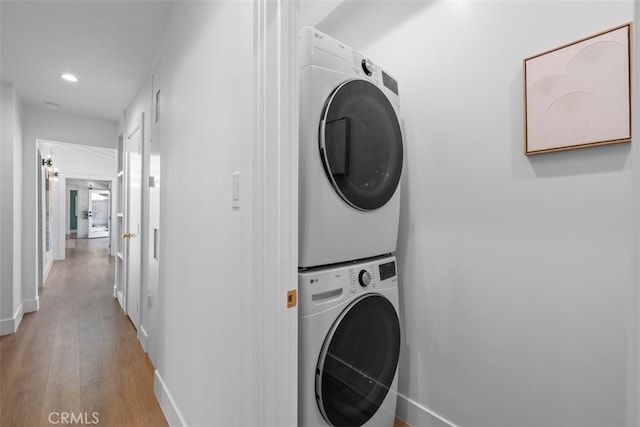 3830 Cedar Ave, Long Beach, CA 90807 - washroom with stacked washer / drying machine, light wood-style floors, baseboards, and recessed lighting