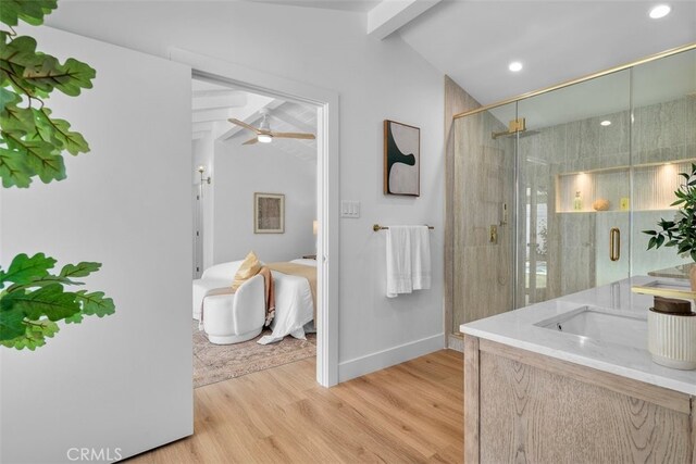 3830 Cedar Ave, Long Beach, CA 90807 - ensuite bathroom featuring wood finished floors, vanity, baseboards, a stall shower, and ceiling fan