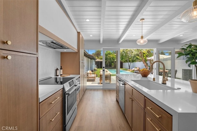 3830 Cedar Ave, Long Beach, CA 90807 - kitchen with stainless steel appliances, a sink, light wood-type flooring, beam ceiling, and light countertops