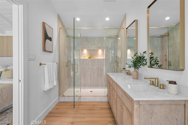3830 Cedar Ave, Long Beach, CA 90807 - ensuite bathroom with double vanity, a stall shower, wood finished floors, baseboards, and recessed lighting