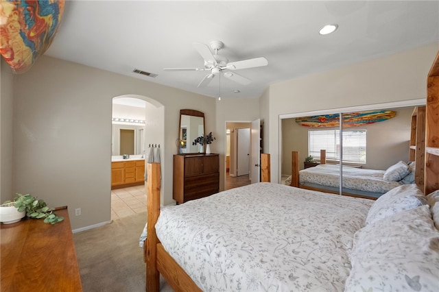 32839 Charmes Ct, Temecula, CA 92592 - bedroom featuring arched walkways, light colored carpet, recessed lighting, baseboards, and a closet