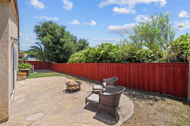 32839 Charmes Ct, Temecula, CA 92592 - fenced backyard with an outdoor fire pit and a patio