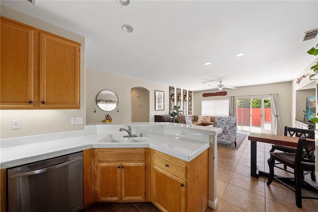 32839 Charmes Ct, Temecula, CA 92592 - kitchen with dishwasher, arched walkways, a peninsula, a sink, and open floor plan