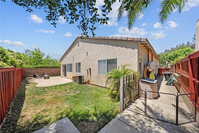32839 Charmes Ct, Temecula, CA 92592 - rear view of house with a patio, stucco siding, cooling unit, and a gate