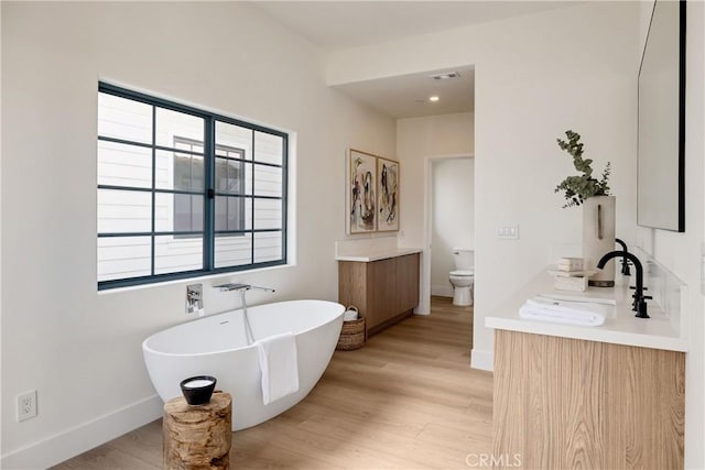 1922 Gates Ave Unit A, Redondo Beach, CA 90278 - full bath with vanity, baseboards, a freestanding bath, and wood finished floors