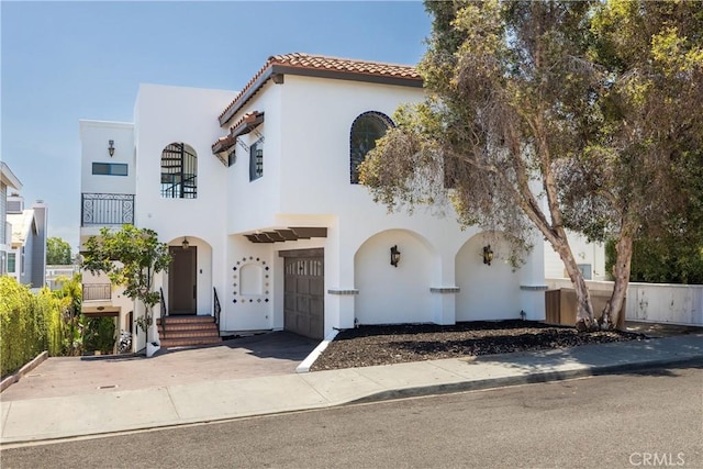 1922 Gates Ave Unit A, Redondo Beach, CA 90278 - mediterranean / spanish house featuring stucco siding, an attached garage, a tiled roof, and concrete driveway