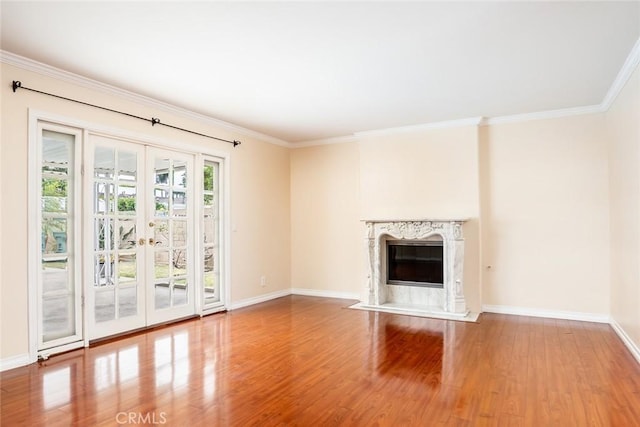 5202 Caliente Dr, Huntington Beach, CA 92649 - unfurnished living room featuring wood finished floors, french doors, baseboards, crown molding, and a premium fireplace