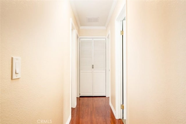 5202 Caliente Dr, Huntington Beach, CA 92649 - hallway with wood finished floors, crown molding, and baseboards