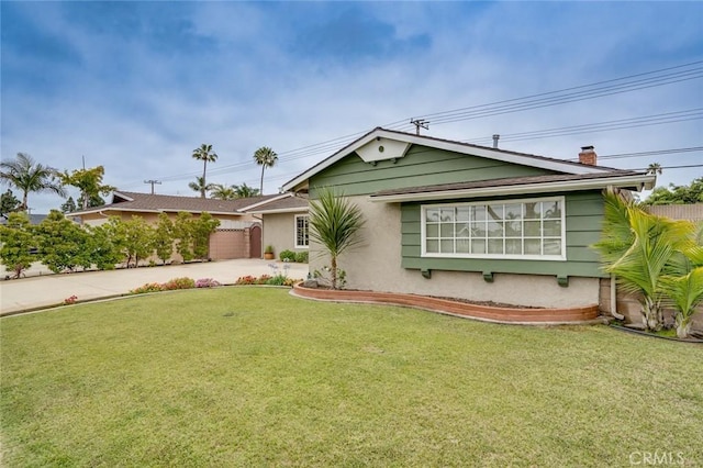5202 Caliente Dr, Huntington Beach, CA 92649 - ranch-style house with concrete driveway, a chimney, and stucco siding
