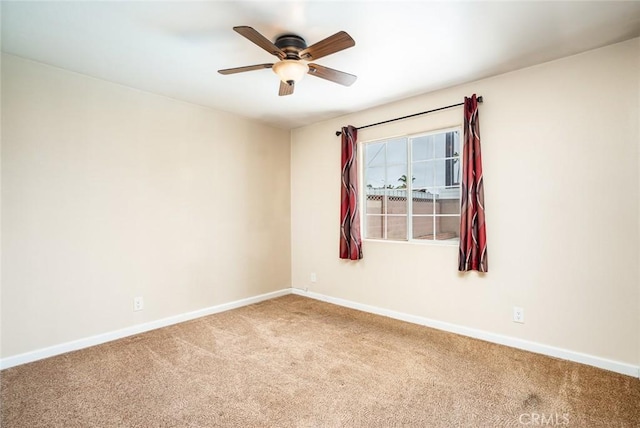 5202 Caliente Dr, Huntington Beach, CA 92649 - carpeted empty room featuring baseboards and a ceiling fan