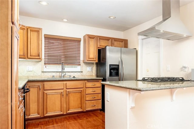 5202 Caliente Dr, Huntington Beach, CA 92649 - kitchen featuring island exhaust hood, stainless steel appliances, a sink, dark wood finished floors, and a kitchen breakfast bar