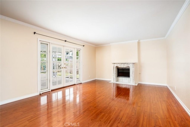 5202 Caliente Dr, Huntington Beach, CA 92649 - unfurnished living room featuring wood finished floors, baseboards, ornamental molding, and a high end fireplace