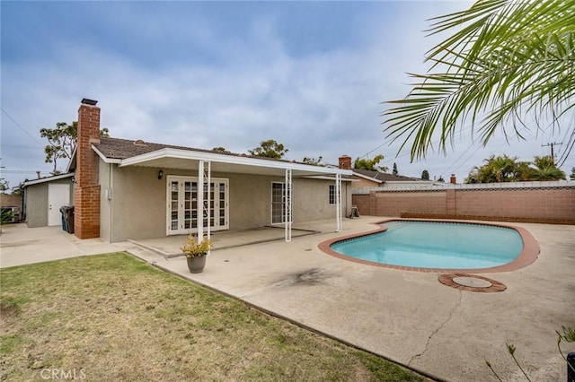 5202 Caliente Dr, Huntington Beach, CA 92649 - view of swimming pool featuring french doors, a fenced backyard, and a patio
