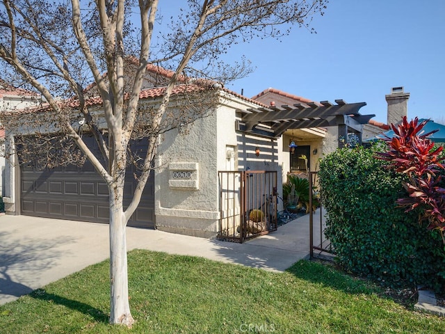8619 San Miguel Pl, Rancho Cucamonga, CA 91730 - view of front facade featuring a gate, concrete driveway, stucco siding, a tile roof, and a garage