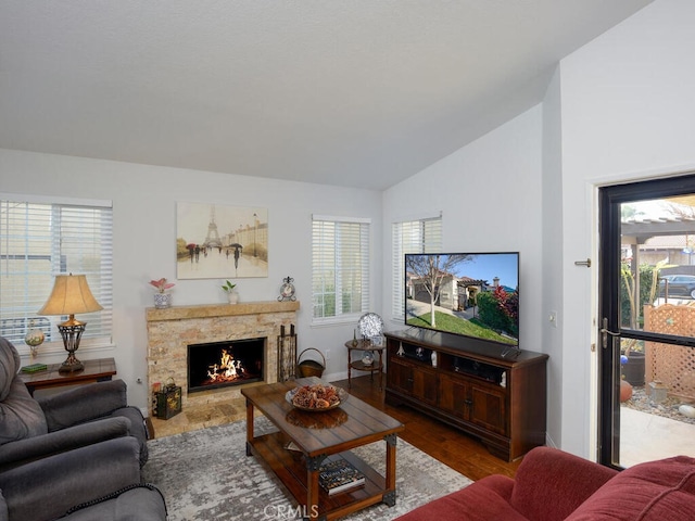 8619 San Miguel Pl, Rancho Cucamonga, CA 91730 - living room with lofted ceiling, a premium fireplace, wood finished floors, and baseboards