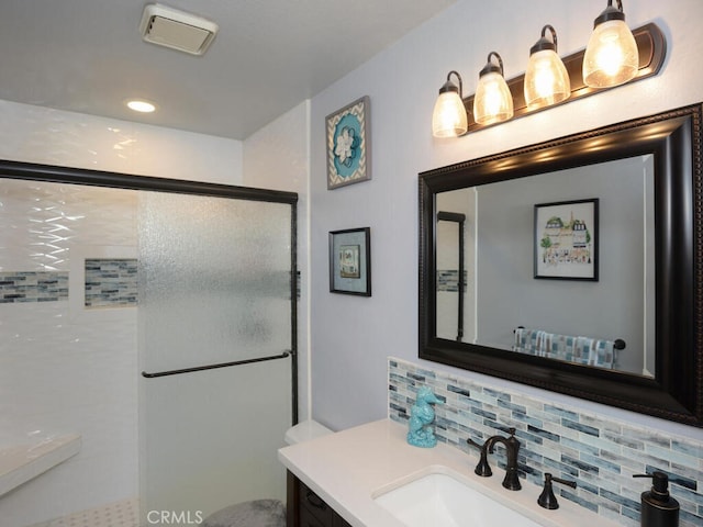 8619 San Miguel Pl, Rancho Cucamonga, CA 91730 - bathroom with toilet, vanity, a shower stall, decorative backsplash, and recessed lighting