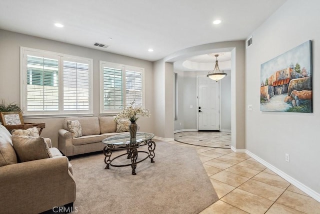 5460 Turin Way, Fontana, CA 92336 - living area featuring light tile patterned flooring, recessed lighting, and arched walkways