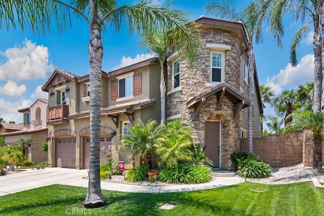 5460 Turin Way, Fontana, CA 92336 - view of front of house featuring stone siding, stucco siding, driveway, and a garage