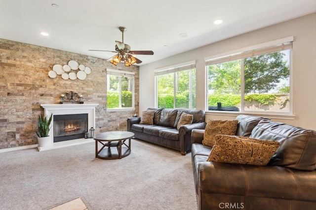 5460 Turin Way, Fontana, CA 92336 - carpeted living room with ceiling fan, a glass covered fireplace, and recessed lighting