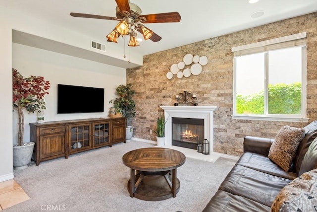 5460 Turin Way, Fontana, CA 92336 - living area featuring a ceiling fan, a glass covered fireplace, and carpet floors