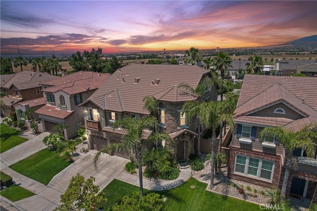 5460 Turin Way, Fontana, CA 92336 - view of front facade with a residential view, concrete driveway, an attached garage, and a tiled roof