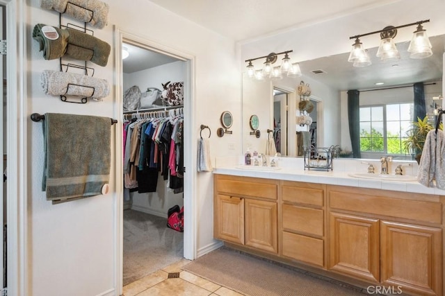 5460 Turin Way, Fontana, CA 92336 - full bath with double vanity, tile patterned flooring, and a walk in closet