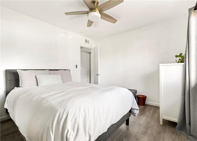 26422 Paseo Carmel Unit 20A, San Juan Capistrano, CA 92675 - bedroom with wood finished floors, baseboards, and a ceiling fan