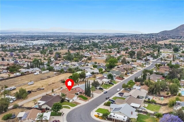 24855 Sundial Way, Moreno Valley, CA 92557 - aerial view of property and surrounding area with nearby suburban area and a mountainous background