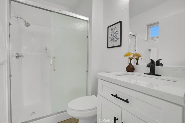 24855 Sundial Way, Moreno Valley, CA 92557 - bathroom featuring vanity, a shower stall, and toilet