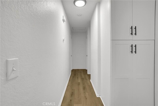 24855 Sundial Way, Moreno Valley, CA 92557 - hall featuring baseboards and light wood-style flooring