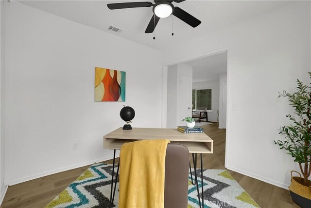 24855 Sundial Way, Moreno Valley, CA 92557 - dining area featuring an office area, wood finished floors, ceiling fan, and baseboards
