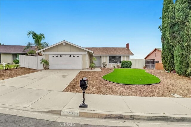 24855 Sundial Way, Moreno Valley, CA 92557 - single story home featuring a garage, driveway, and a chimney
