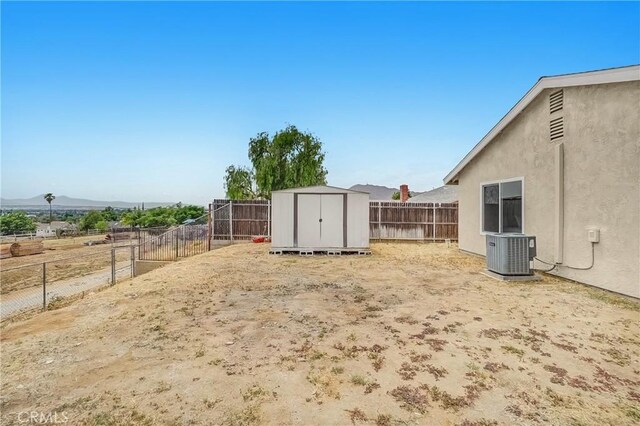 24855 Sundial Way, Moreno Valley, CA 92557 - fenced backyard featuring central AC and a mountain view