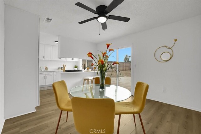 24855 Sundial Way, Moreno Valley, CA 92557 - dining room featuring light wood-style floors, ceiling fan, and baseboards