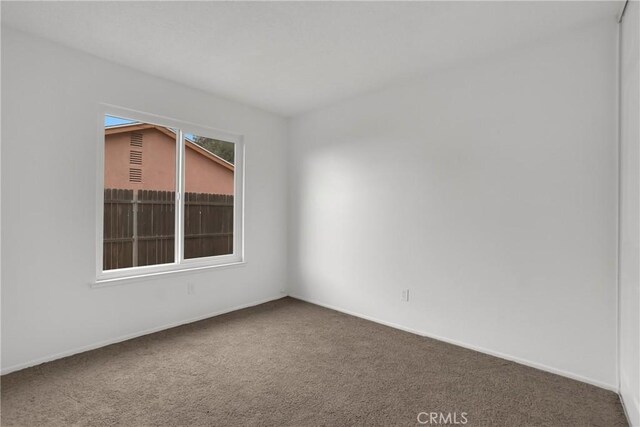 24855 Sundial Way, Moreno Valley, CA 92557 - carpeted empty room with baseboards