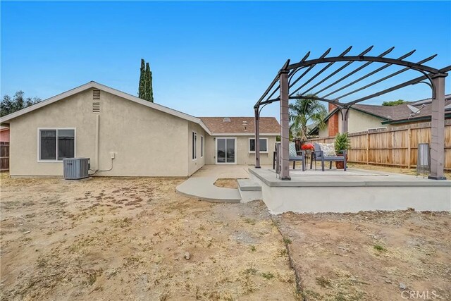 24855 Sundial Way, Moreno Valley, CA 92557 - rear view of property featuring a patio area, stucco siding, central AC unit, and a pergola