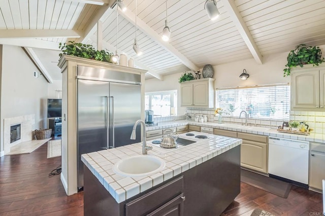 719 Singing Trails Dr, El Cajon, CA 92019 - kitchen with white appliances, tile countertops, an island with sink, dark wood-style floors, and tasteful backsplash