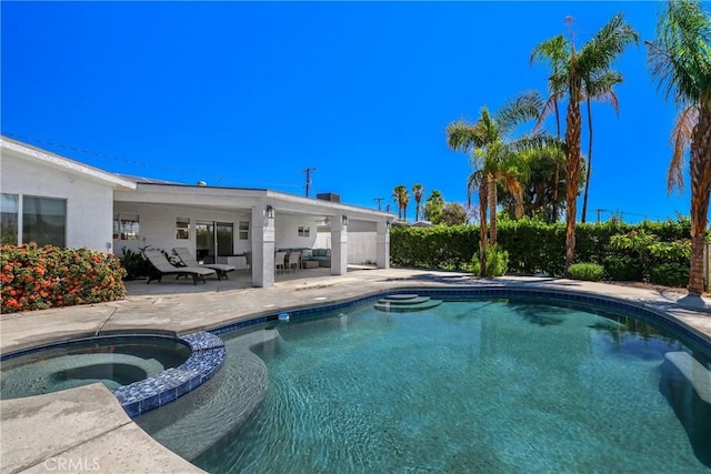 77355 Minnesota Ave, Palm Desert, CA 92211 - view of pool featuring a patio and a pool with connected hot tub