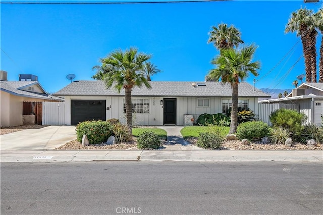 77355 Minnesota Ave, Palm Desert, CA 92211 - ranch-style house with an attached garage, board and batten siding, and concrete driveway