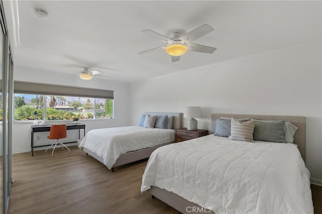 77355 Minnesota Ave, Palm Desert, CA 92211 - bedroom with wood finished floors, a ceiling fan, and ornamental molding