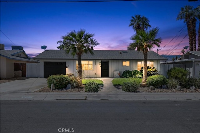 77355 Minnesota Ave, Palm Desert, CA 92211 - ranch-style home with an attached garage, board and batten siding, and driveway