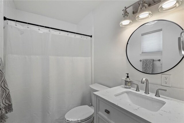 77355 Minnesota Ave, Palm Desert, CA 92211 - bathroom with vanity, toilet, and a shower with shower curtain