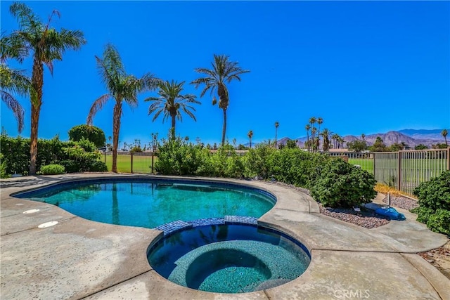 77355 Minnesota Ave, Palm Desert, CA 92211 - view of pool with a pool with connected hot tub and a mountain view